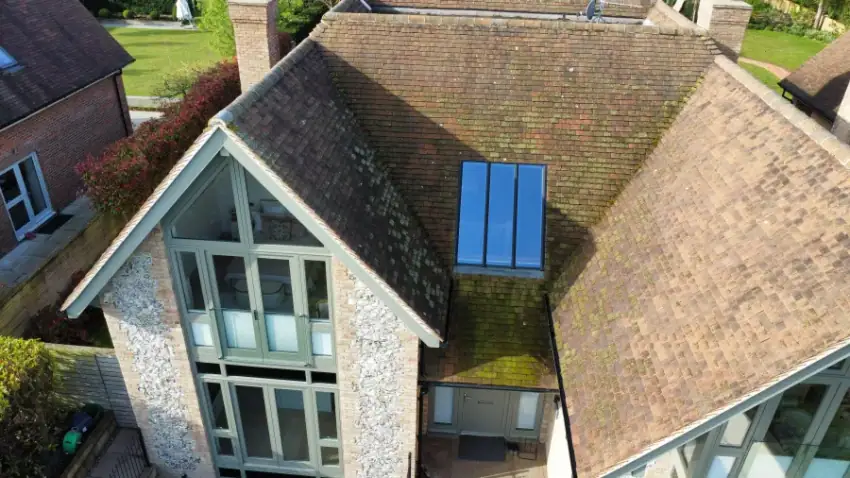 Roof tiles covered in moss and algae before cleaning, Beaconsfield HP9