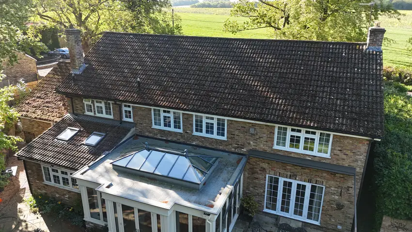 Moss on the tiled roof above an orangery before cleaning in Penn HP10